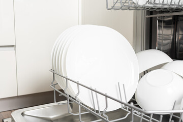 Full load dishwashing machine. Clean dishes and cutlery