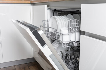 Full load dishwashing machine. Clean dishes and cutlery