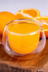 Freshly squeezed orange juice on a white background. Fresh orange juice. close up