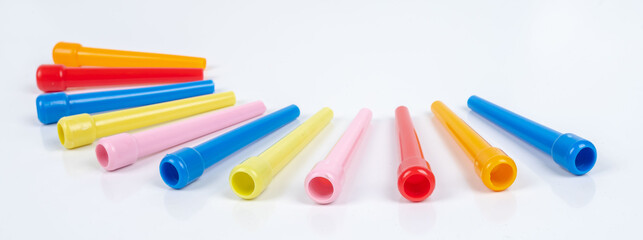 Colored plastic hookah mouth tips, standing in an isolated private environment, accessories on a white background