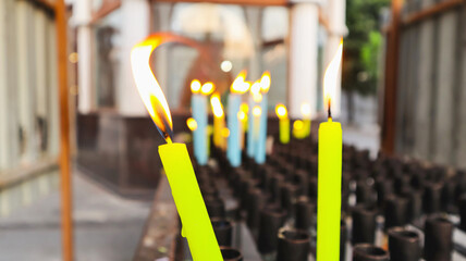 Burning candles at  St. Thomas Cathedral Basilica, Chennai, Tamilnadu, India Present structure dates to 1523 AD, when it was built by Portuguese, over tomb of Thomas Apostle - obrazy, fototapety, plakaty