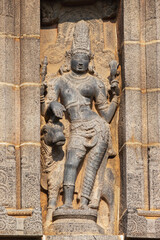 Carved idol of Lord Shiva as Ardhanarishwara half man and half woman on Gopuram of Nataraja Temple, Chidambaram, Tamil Nadu, India