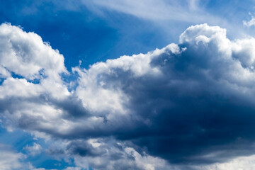 thick and relief clouds in the blue sky
