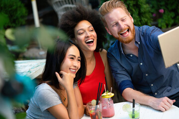 Young friends having a great time together. Group of people talking and smiling.