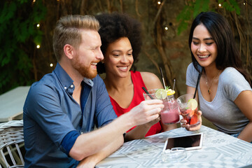 Young friends having a great time together. Group of people talking and smiling.