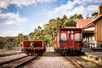 Obraz premium red train carriages at old station tasmania