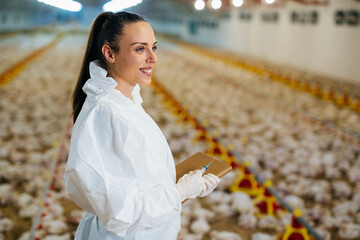 veterinarian posing in chicken farm © cherryandbees