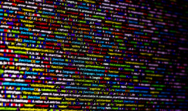 Colorful code background. compressed javascript code on computer screen. Software developer coding screen