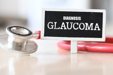 GLAUCOMA word on a small chalk board next to a stethoscope.