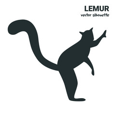 Vector silhouette of a lemur hugging a tree