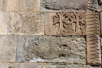 Close-up ornamental carvings on the wall of the church in Geghard monastery. Geghard monastery,...