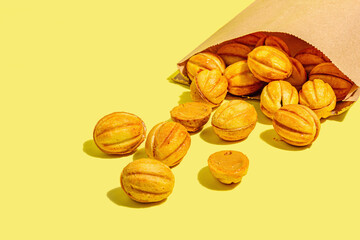 Cookies in the shape of walnuts with condensed milk cream filling.Delicious shortbread sandwiches