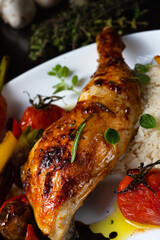 Rustic fried chicken legs with assorted vegetables and rice