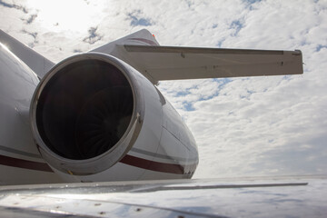 The jet engine of a white and brown private passenger plane. VIP aviation, private aviation, aviation industry, travel