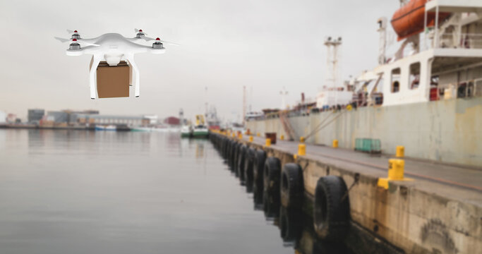 Drone carrying a box in a port