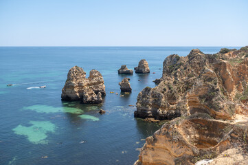 Fototapeta na wymiar Panorama of the tourist Praia do Camilo de Lagos in the Algarve, Portugal in the summer of 2022.