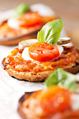 Mini Pizza Margherita with fresh Tomato, Mozzarella, Mushrooms and Basil.