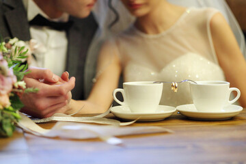 Bride and groom's Coffee time, coffee break.Hand in hand