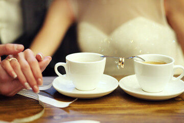 Bride and groom's Coffee time, coffee break.Hand in hand