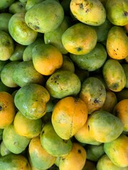 Green and yellow mango. Tropical fruit. 