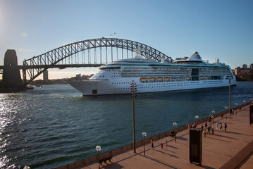 Large cruise ship driving to the bay in front of the bridge, Harbour Bridge, Sydney 