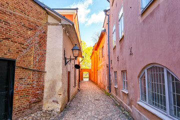 Fototapeta premium Medieval narrow alley in Turku, Finland called Luostarin välikatu. It used to lead from the monastery to the city centre and the cathedral.
