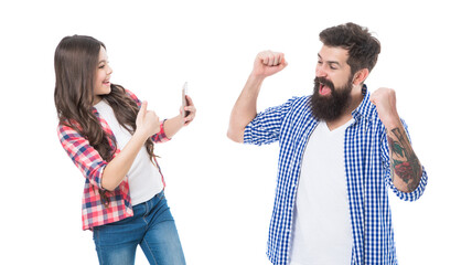 Happy girl daughter show thumbs up and take photo of euphoric man father making winning gesture...