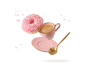Vintage cup hot coffee, golden spoon with pink glazed donut with sprinkles flying isolated on white...