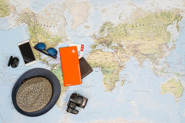 Fototapeta na wymiar Travel accessories on the world map.