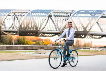 Business man riding a vintage bicycle in the city.