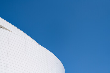 Architectural detail of modern building facade exterior architecture on blue sky, copy space