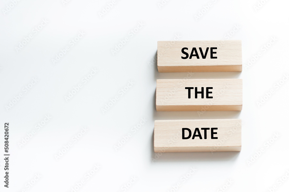 Poster save the date word written on wood block. save the date text on table, concept