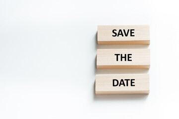 Save the Date word written on wood block. Save the Date text on table, concept