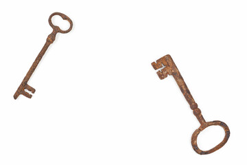 Vintage cast iron keys on white background with copy space.