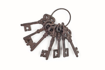 Old rusty  keys on white background