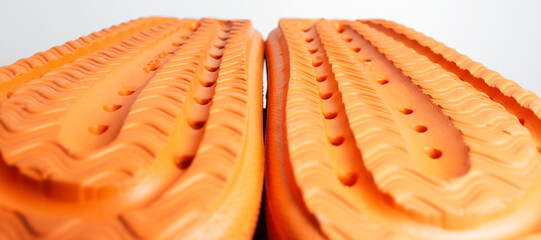 Close-up of colourful slippers sole of orange color.