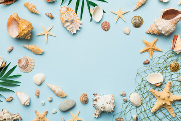 Summer time concept Flat lay composition with beautiful starfish and sea shells on colored table, top view with copy space for text - obrazy, fototapety, plakaty