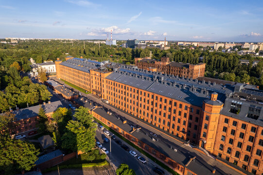 Ł&oacute;dź City on a sunny day. Characteristic places, buildings and streets. Piotrkowska Street from the bird's eye view.