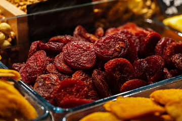 Delicious dried fruits on counter at a street market