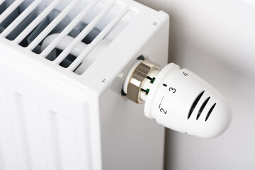Valve knob of heating radiator battery temperature thermostat in winter cold season