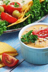 Hummus with vegetables salad and nachos