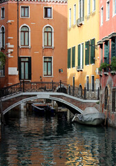 Venice canal view. Colorful facades, boats, calm river water. Beautiful architecture of Italy. Most romantic travel destinations. 