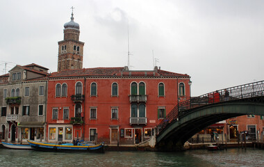 Naklejka premium Beautiful city view of Venice Canals, Streets and Monuments. Colorful buildings near water. Sunny day in Italy. Tourist destinations concept. 
