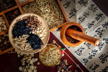 Chinese herbal medicine and flower tea on wooden