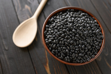Fresh organic natural beans on wooden rustic black background