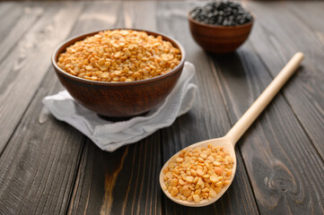 Fresh organic natural peas on a wooden rustic black background