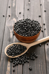 Fresh organic natural beans on wooden rustic black background