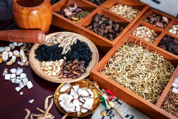 Chinese herbal medicine and flower tea on wooden