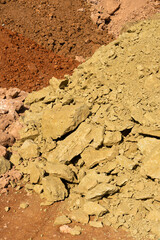 Accumulation of very dry earth with earthy colors, predominantly ocher and pink.