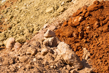 Accumulation of very dry earth with earthy colors, predominantly ocher and pink.